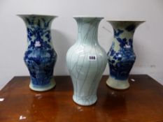 TWO SIMILAR CHINESE CELADON GROUND VASES PAINTED IN BLUE WITH FLOWERS AND FOLIAGE. H 37cms. TOGETHER