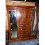 A LARGE EDWARDIAN MAHOGANY COMPACTUM WARDROBE.