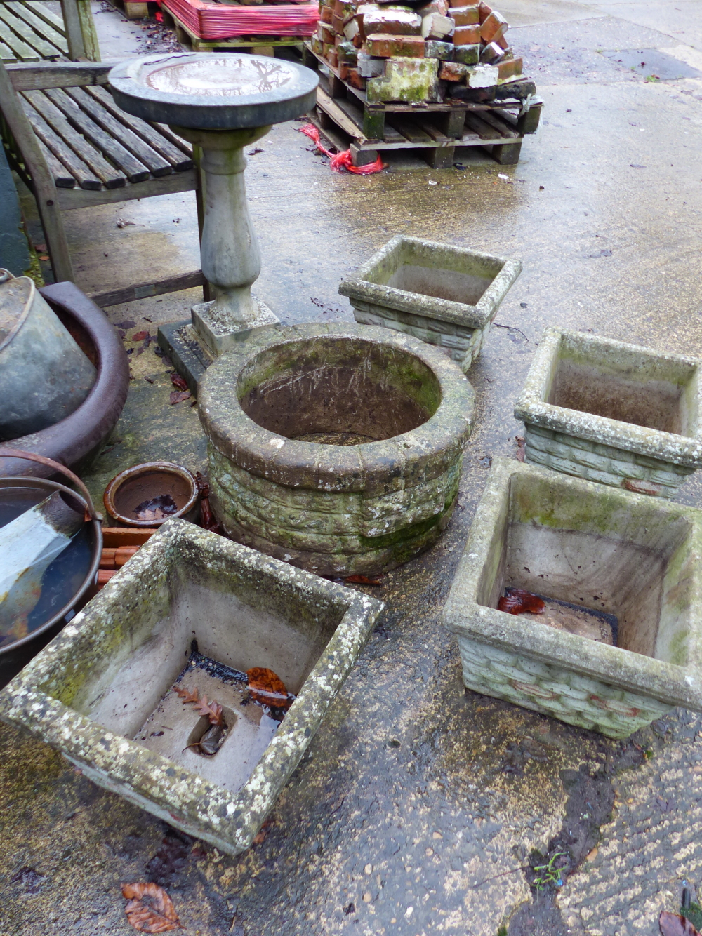 FOUR CONCRETE PLANTERS, A WELL TOP AND BIRD BATH.