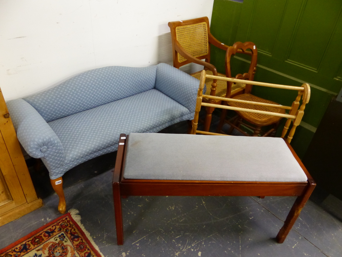 A SMALL UPHOLSTERED WINDOW SEAT, TWO CANE SEATED CHAIRS, A TOWEL RAIL AND A DUET STOOL.