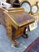 A VICTORIAN WALNUT DAVENPORT DESK.