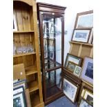 A GLAZED DISPLAY CABINET.