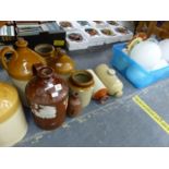 A GROUP OF STONEWARE FLAGON'S AND TWO HOT WATER BOTTLES