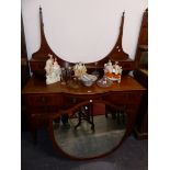 A GOOD QUALITY EDWARDIAN MAHOGANY DRESSING TABLE, WITH LARGE SHIELD FORM MIRROR.