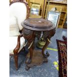 AN ANTIQUE CARVED HARDWOOD EASTERN URN STAND WITH ELEPHANT HEAD SUPPORTS. Dia. 48cm x H. 80cm.