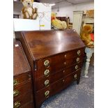 A GEORGE III MAHOGANY BUREAU WITH WALNUT VENEERED INTERIOR.