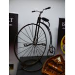 A VINTAGE IRON "ORDINARY BICYCLE" ( PENNY FARTHING) WITH DISPLAY STAND 108 CM HIGH