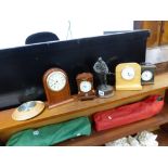 FOUR DESK CLOCKS, A BAROMETER, AND A PETER HICKS SOLDIER FIGURINE.