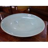 A LARGE 19th C. CHINESE CELADON CRACKLE GLAZE SHALLOW BOWL.