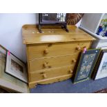 A SMALL PINE THREE DRAWER CHEST.