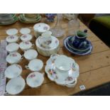 A CRESCENT CHINA JUNE TIME PATTERN PART TEA SERVICE, TWO DECANTERS, AND A BLUE AND WHITE CHINA JUG