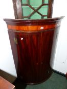 AN INLAID MAHOGANY BOWFRONT GEORGIAN HANGING CORNER CABINET 111 CM HIGH X 75 CM WIDE