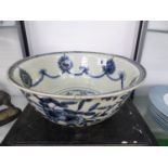 A WANLI BLUE AND WHITE BOWL, THE INTERIOR WITH SWAGS HELD BY ALTERNATING ROSETTES AND RUYI LAPPETS