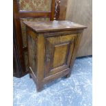 AN ANTIQUE CONTINENTAL OAK PANEL DOOR SMALL SIDE CABINET.