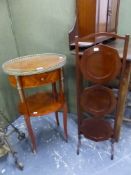 A CONTINENTAL STYLE BRASS MOUNTED TWO TIER OCCASIONAL TABLE AND A FOLDING CAKE STAND.