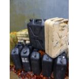 A QUANTITY OF JERRY CANS.
