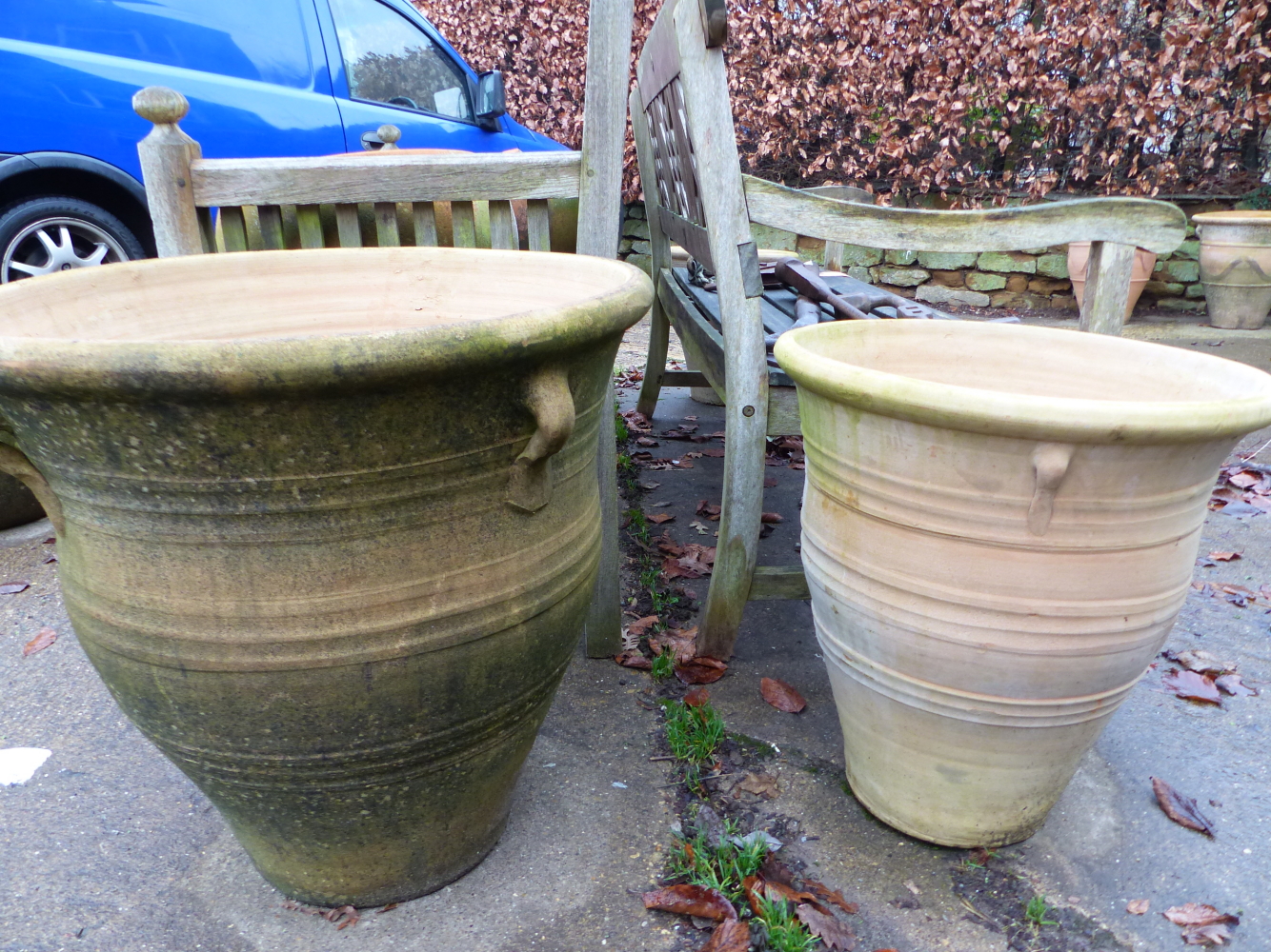 TWO PAIRS OF LARGE TERRACOTTA PLANTERS