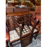 A GLOBE WERNICKE TYPE THREE TIER BOOKCASE AND THREE OAK SIDE CHAIRS.