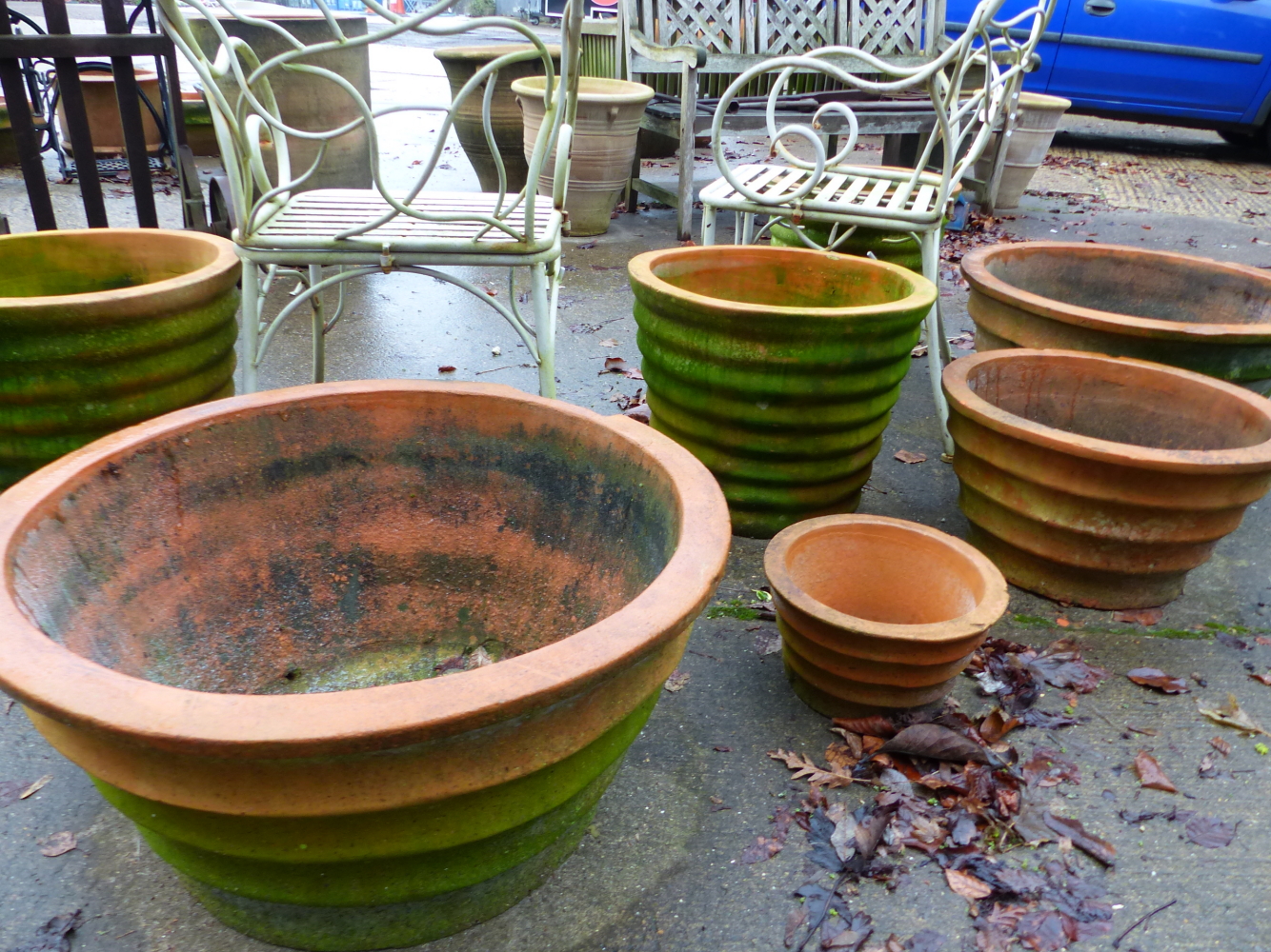 SEVEN VARIOUS RIBBED SIDED LARGE PLANTERS