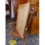 A ROCKING CHAIR AND A PINE CORNER CABINET.