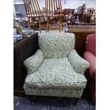 A LATE VICTORIAN HOWARD STYLE DEEP SET ARMCHAIR ON SQUARE TAPER LEGS WITH BRASS CASTORS, AND ANOTHER