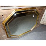 AN OCTAGONAL MARGINAL FRAMED MIRROR.