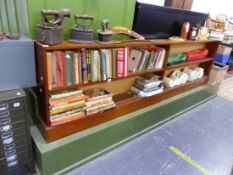 A LONG LOW MAHOGANY BOOK CASE.