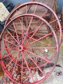 A PAIR OF CART WHEELS.