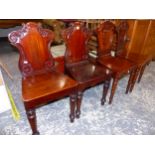 A PAIR OF VICTORIAN MAHOGANY HALL CHAIRS WITH CARTOUCHE BACKS, TOGETHER WITH A FURTHER PAIR OF