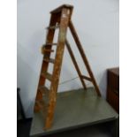 A VINTAGE DECORATIVE STEP LADDER.