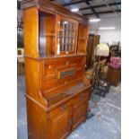 A LATE VICTORIAN CARVED WALNUT SECRETAIRE CABINET, FITTED INTERIOR WITH FALL FRONT ABOVE DRAWERS AND