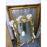 A CARVED GILT WOOD ROCOCO STYLE WALL MIRROR, A PAINTED FRAME MIRROR, AND A RECTANGLE GILT FRAME