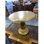 A CARVED GILTWOOD CIRCULAR LOW OCCASIONAL TABLE.