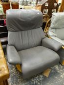 A GREY LEATHER SWIVEL ARM CHAIR.