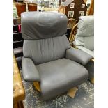 A GREY LEATHER SWIVEL ARM CHAIR.