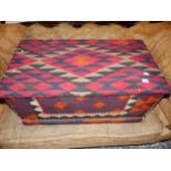 ANTIQUE PINE BLANKET BOX LATER UPHOLSTERED WITH FLAT WEAVE KELIM CARPET. W 86 X D 46 X H 39cms.