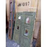 A PAIR OF CARVED AND PAINTED EASTERN HARDWOOD PANELS, A PART FOLDING SHUTTER, FOLDING TRESTLES,