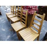 A SET OF SIX TAPERED LADDER BACK SLAT SEATED SIDE CHAIRS. SEAT HEIGHT 45cms, TOGETHER WITH THREE