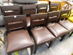 A SET OF EIGHT GOOD QUALITY MODERN DESIGNER LEATHER UPHOLSTERED DINING CHAIRS.