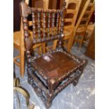 AN EARLY OAK LOW SIDE CHAIR WITH BOBBIN SUPPORTS. SEAT HIGHT 36cms