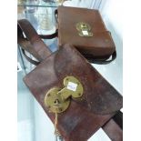 TWO VINTAGE LEATHER POUCHES WITH BRASS LOCKS.