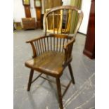 AN ANTIQUE WINDSOR CHAIR WITH FIVE STICK BACK, SADDLE SEAT AND RING TURNED LEGS.