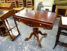 A CARVED MAHOGANY VICTORIAN TEA TABLE WITH SCROLL LEGS.