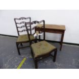 A GEORGE III MAHOGANY SIDE TABLE TOGETHER WITH A PAIR OF ANTIQUE PIERCED LADDER BACK DINING CHAIRS.