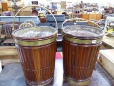 A PAIR OF MAHOGANY AND BRASS MOUNTED PEAT BUCKETS.