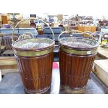 A PAIR OF MAHOGANY AND BRASS MOUNTED PEAT BUCKETS.