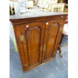 A GEORGE III BURR WALNUT AND INLAID TWO PANEL DOOR CORNER CABINET, WITH SHAPED SHELF INTERIOR. W