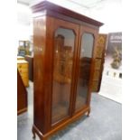 A LARGE EARLY 20th C. MAHOGANY GLAZED TWO DOOR BOOKCASE, WITH ADJUSTABLE SHELVES. W 134 X D 38 X H