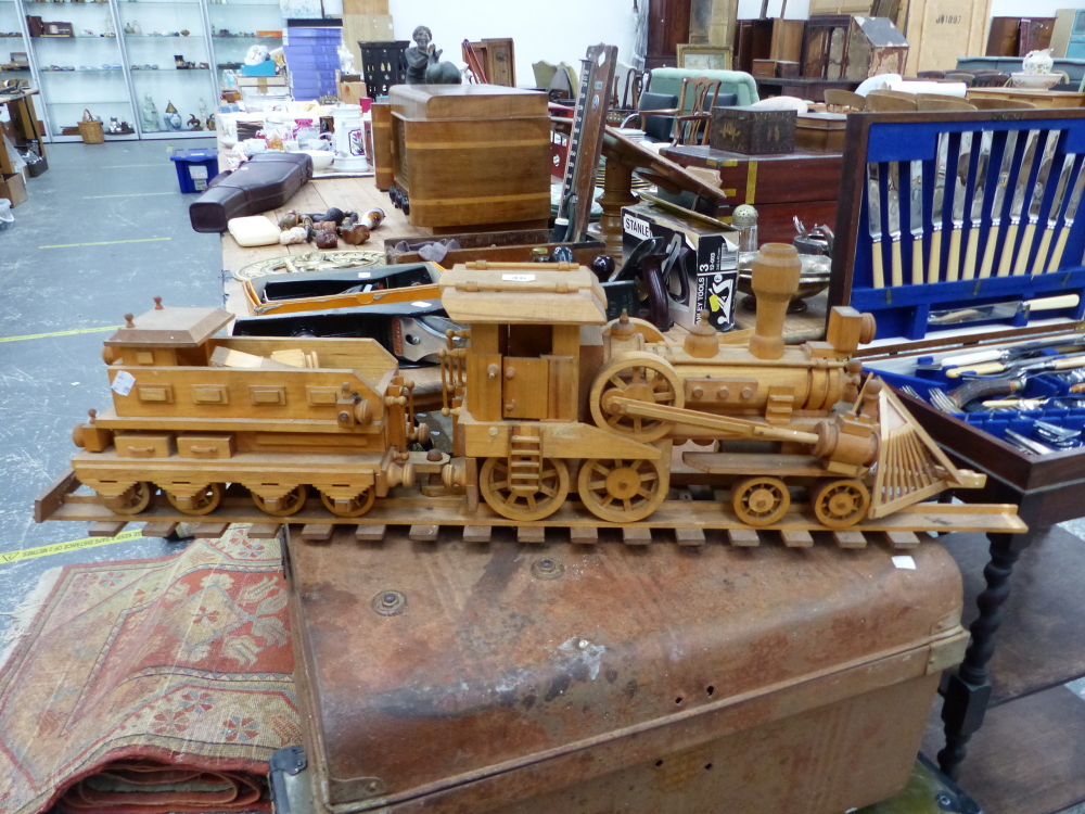 AN APPARENTLY SCRATCH BUILT MODEL LOCOMOTIVE TOGETHER WITH TENDER AND TRACK.