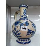 A DELFT BLUE AND WHITE EWER.